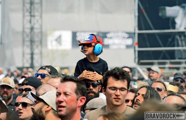 Father carrying child on his back - Hellfest 2019